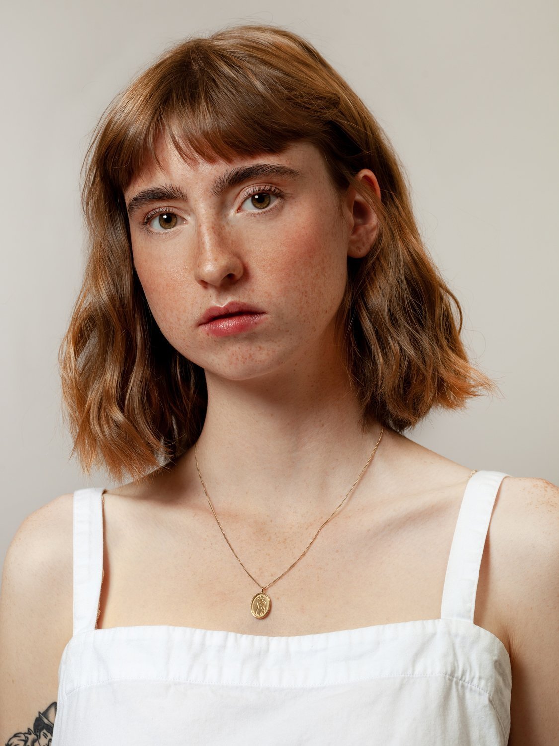 Femme Pendant in Gold