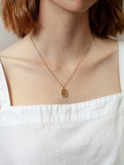 Femme Pendant in Gold