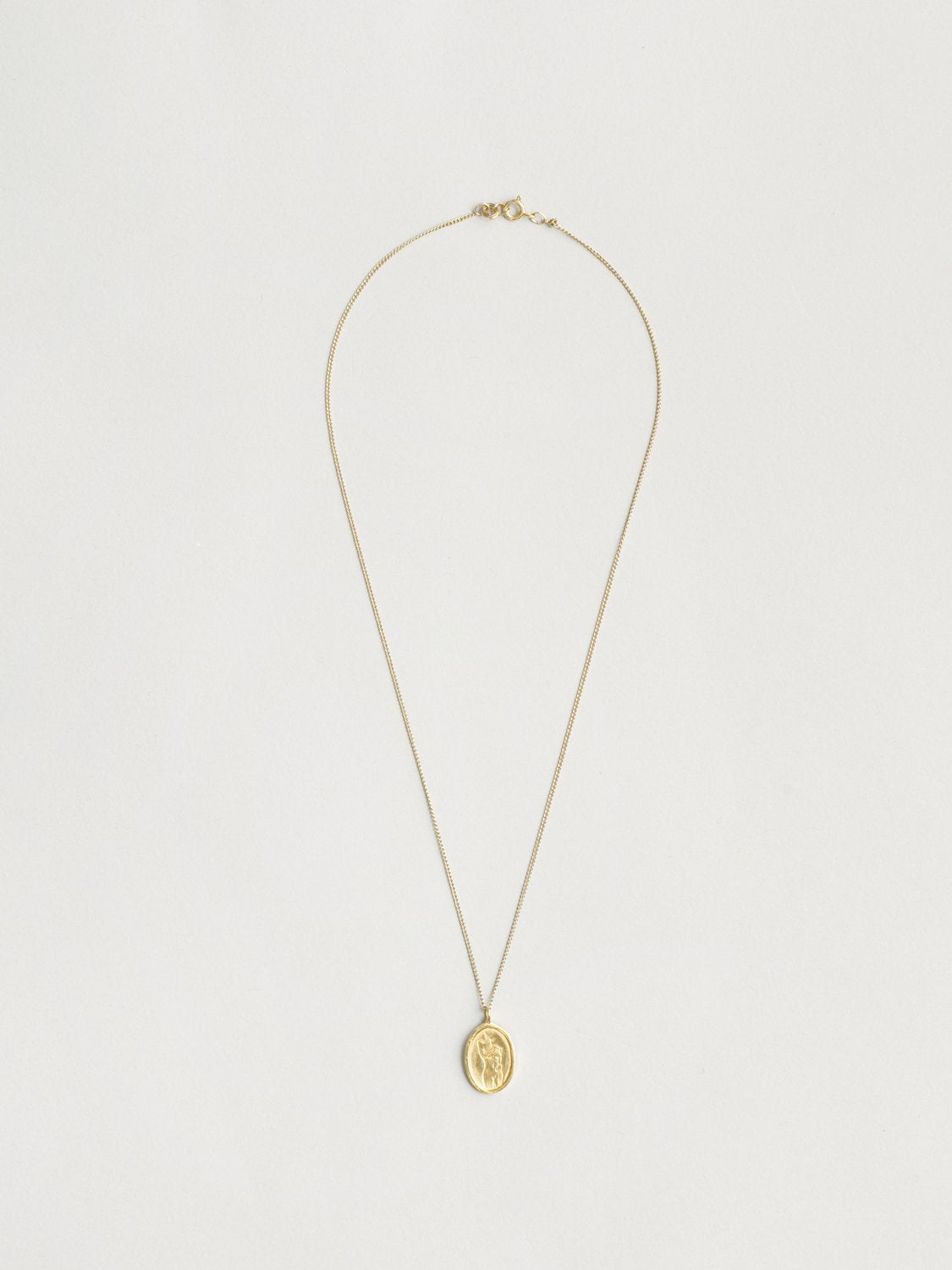 Femme Pendant in Gold