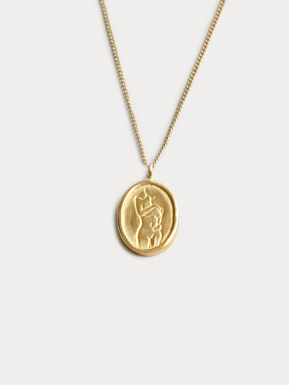 Femme Pendant in Gold