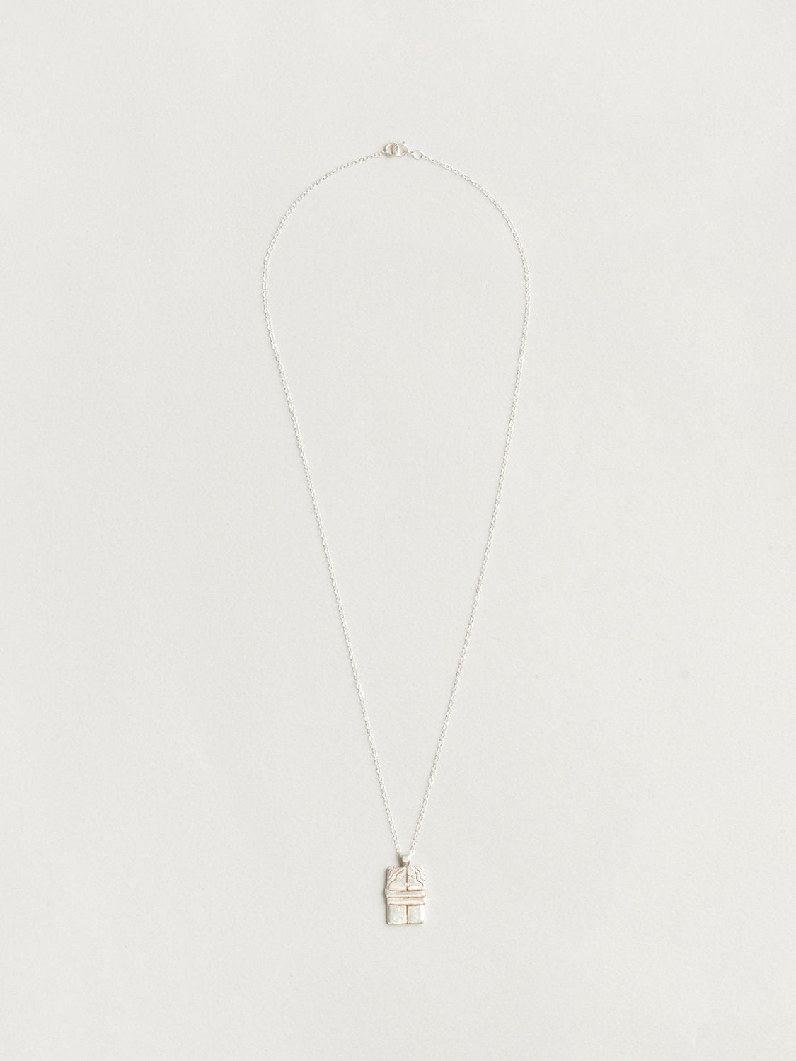 The Kiss Necklace in Sterling Silver
