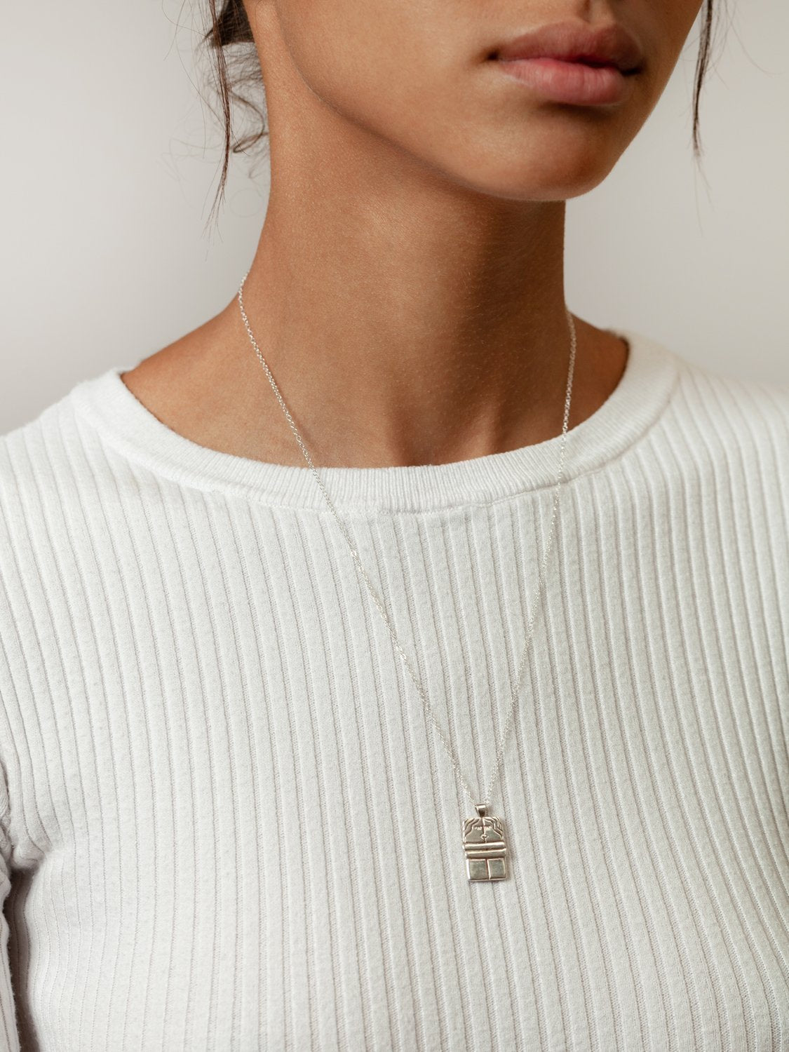 The Kiss Necklace in Sterling Silver